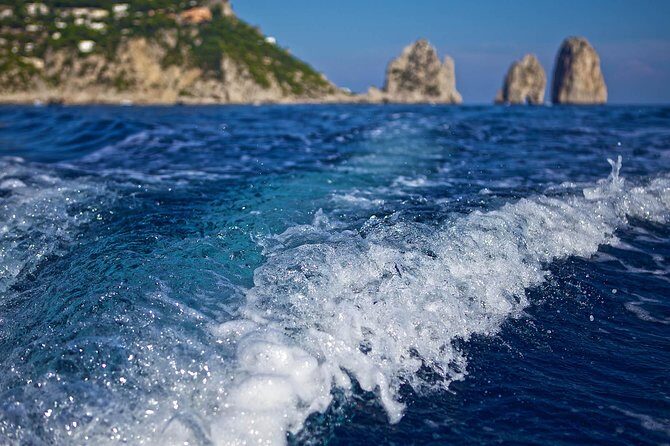 Capri Boat tour from Positano with Light Lunch, Drinks & Swim - Capri from the sea: Malaparte, stacks, Punta Carena, and the arch