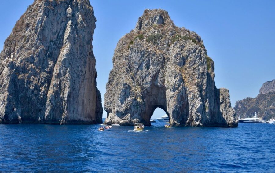 From Positano: Day trip to Capri - Group Tour by boat - The Faraglioni views, then a final ride toward Punta Campanella